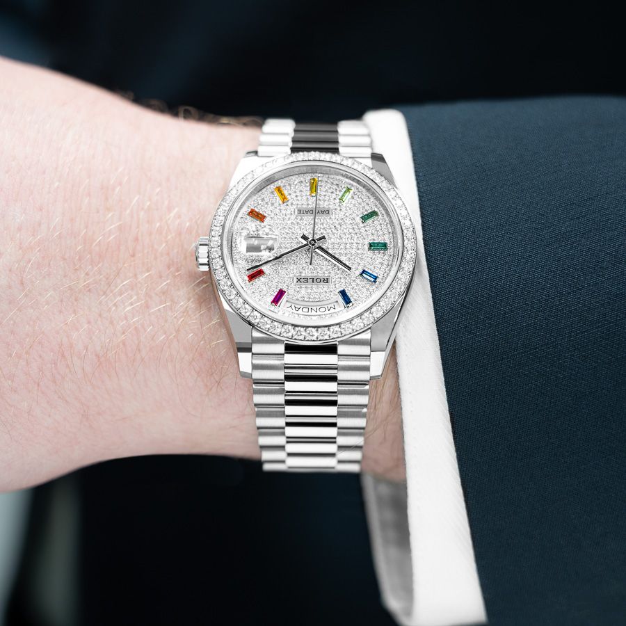 Modeling the Rolex Day-Date 36 128349RBR in 18k White Gold with a Diamond-Paved Dial with Rainbow Sapphire Markers