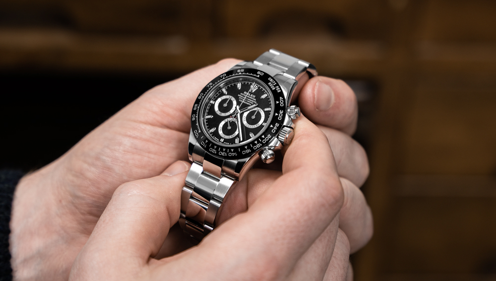 Client inspecting a Rolex Daytona 116500LN