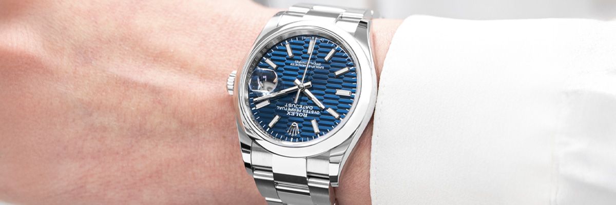 Rolex Datejust 36 126200 Wristwatch, Blue Fluted Motif Dial Rolex Datejust 36 126200 wristwatch with the Blue Fluted Motif dial being worn on a woman model